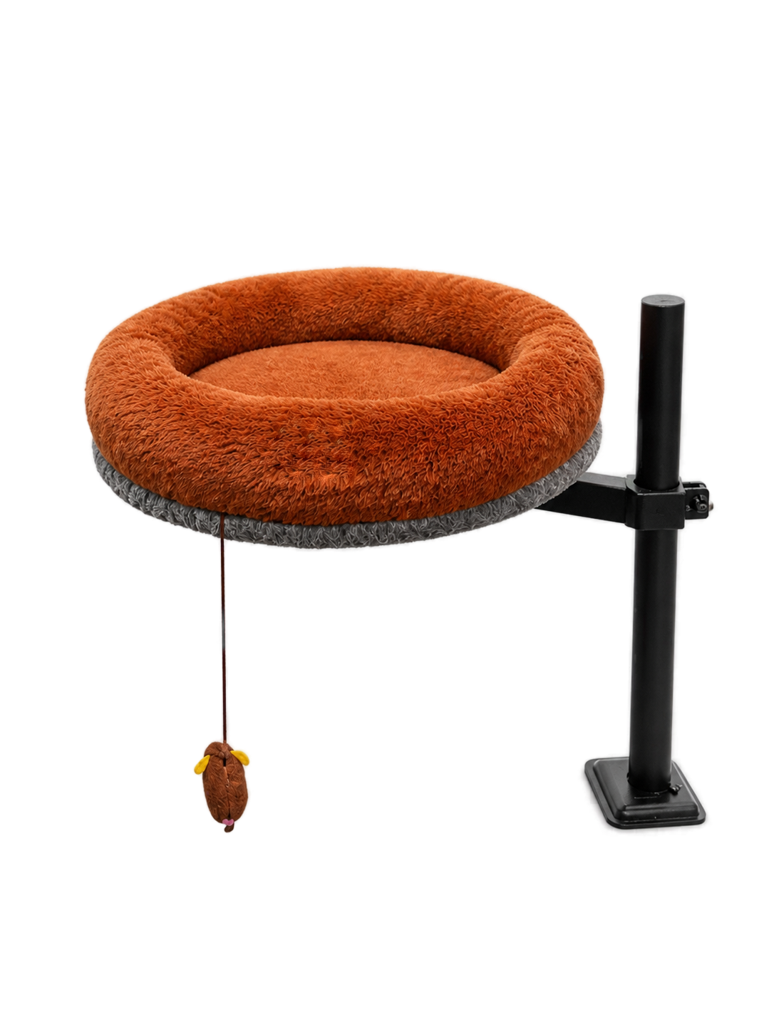 Side view of the Petyze adjustable cat desk bed featuring a plush burnt-brown donut cushion with gray woven base, mounted on a black metal pole with clamp arm and desk-edge clamp, plus a small hanging mouse toy under the bed.