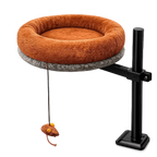 High-angle view of Petyze cat desk bed with plush brown donut cushion on metal stand and toy.