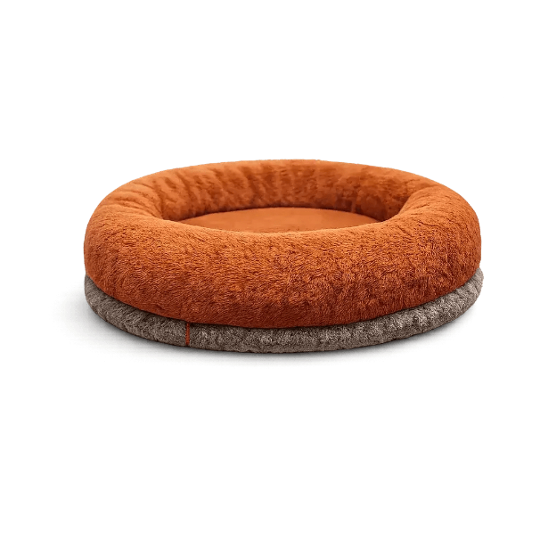 Donut-style rust-brown plush Petyze cat bed with recessed center on a dark gray base.